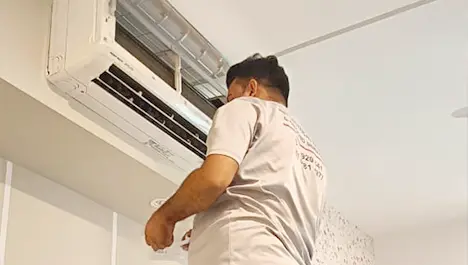 Maintenance team working on aircond